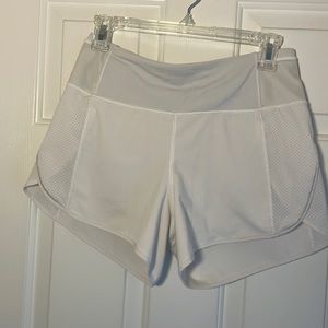 Lululemon mid-rise white size 6 woman’s lined shorts.
